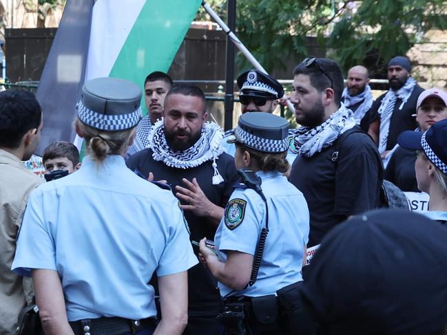 Police speak to organisers of the rally ahead of the march. Picture: David Swift