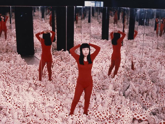 Yayoi Kusama in one of her Infinity Rooms.