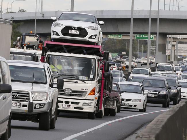 Traffic was brought to an almost standstill as Australian Prime Minister Malcolm Turnbull with Karen Andrews and Bert Van Manen   at exit 31, Loganholme,  announcemented a $215 million upgrade of the M1 to help stop congestion .  . Photo: Jerad Williams
