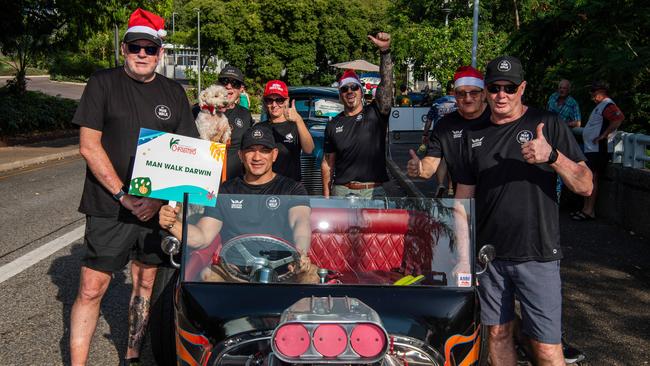 Man Walk Darwin as thousands of Territorians braved the tropical heat for A Very Darwin Christmas Pageant. Picture: Pema Tamang Pakhrin