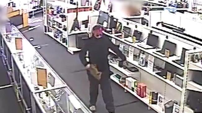 Jason Robert Konow disguised himself with a wig and used a gel blaster to rob a Cash Converters in Robina. Picture: Queensland Police Service