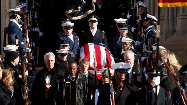 US military body bearers carry the flag-draped casket bearing the remains of Jimmy Carter from the Washington National Cathedral following his state funeral. Picture: Getty Images via AFP