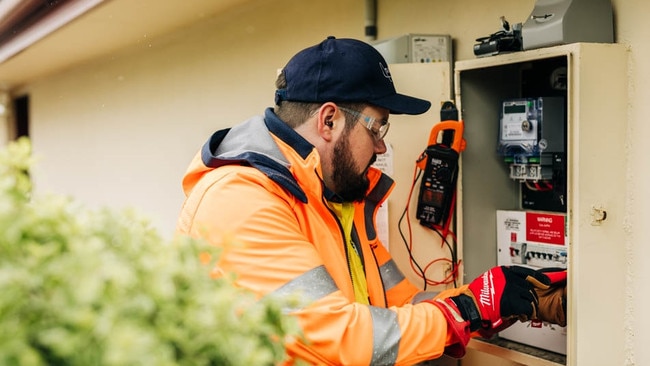 An Aurora Energy technician installing an advanced meter. Picture: Supplied