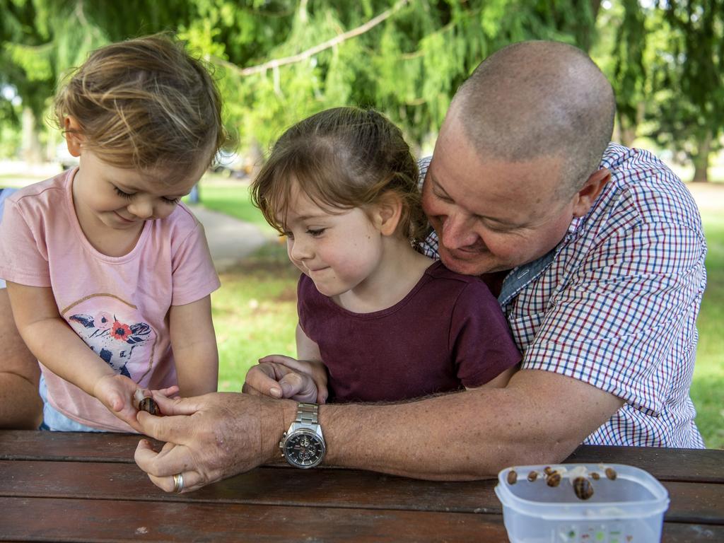 The Hughes family are excited to be embarking on their snail farm journey. Daughters Primrose (left) Daisy (centre) and Wes Hughes from Snailed It snail farm. Picture: Nev Madsen