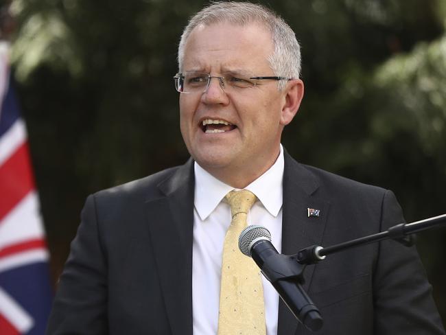 Australian Prime Minister Scott Morrison speaks during the unveiling of a Gandhi statue in the Sydney suburb of Parramatta, Thursday, Nov. 22, 2018. Earlier Morrison revealed plans to increase government powers to strip citizenship from extremists and to control the movements of Australian fighters who return home from the battlefields of Syria and Iraq. (Mark Metcalfe/Pool Photo via AP)