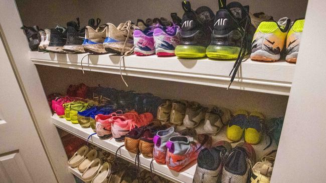 Inside the linen cupboard are dozens of kids’ shoes. Picture: Nigel Hallett.