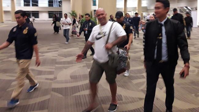 Koshan Radford being escorted at Bali airport.