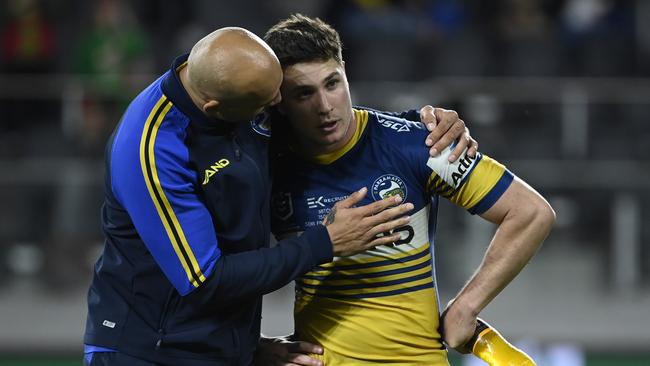 Brad Arthur consoles Mitch Moses.