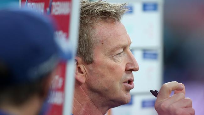 HOBART, AUSTRALIA - JUNE 13: Kangaroos head coach David Noble talks to his players during the round 13 AFL match between the North Melbourne Kangaroos and the Greater Western Sydney Giants at Blundstone Arena on June 13, 2021 in Hobart, Australia. (Photo by Mark Metcalfe/AFL Photos/via Getty Images)