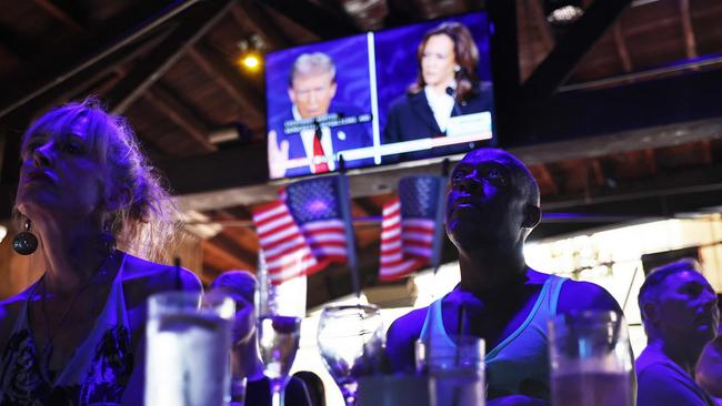 People watch the presidential debate at The Abbey, an iconic gay bar in West Hollywood. Photo: Mario Tama