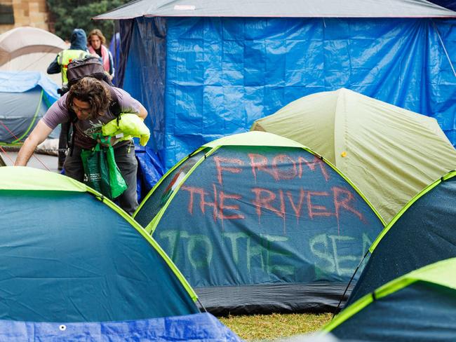 Pro-Palestinian rally and tent city at Sydney university, including tents with graffiti saying free Gaza and from the river to the sea. Picture: NCA NewsWire / David Swift