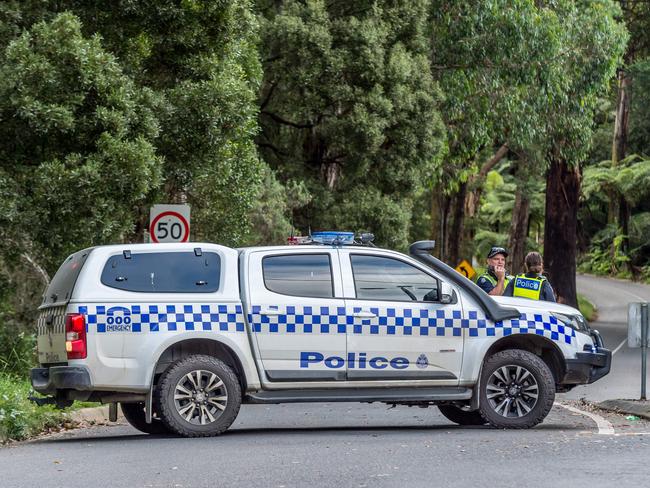 Fatal accident. Sherbrooke Rd, Kallista. Police maintain a road block at the scene of a fifth accident. Picture: Jake Nowakowski