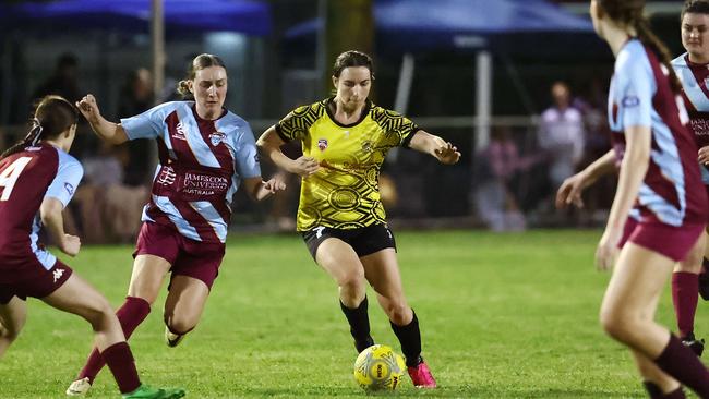 Strikers' Astia Neckebroeck and Tigers' Shelley Macaulay contest the ball in the Football Queensland Premier League (FQPL) Far North and Gulf women's grand final match between the Edge Hill Tigers and the Redlynch Strikers, held at Endeavour Park, Manunda. Picture: Brendan Radke