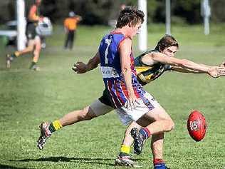 A Maroochy-Northshore defender tries to smother the kick of Wilston Grange’s Zac Molan earlier this season. Picture: Cade Mooney