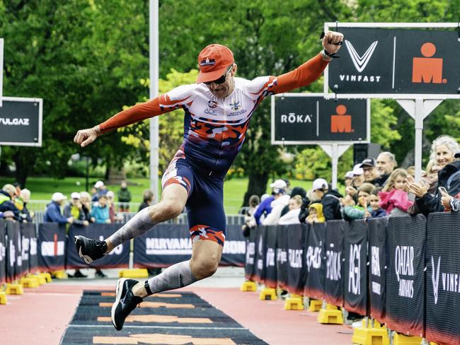 An athlete in the Aquabike Tasmania crosses the line in Hobart on Sunday 4th February 2024. Picture: Linda Higginson