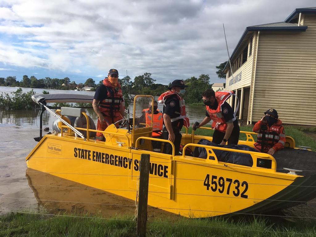 An SES boat on its way to Granville, which has been isolated by the floods.