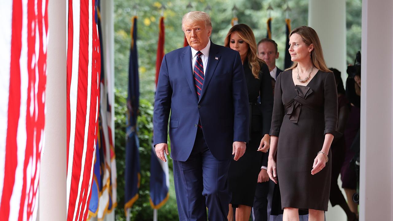 Donald Trump with Amy Coney Barrett, the second-youngest person ever appointed to the Supreme Court. Picture: Getty Images