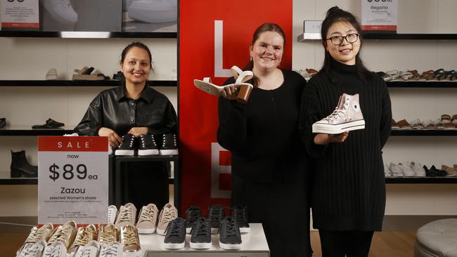 Myer team members Anjila Subedi, Alice Mummery and Cayla Lin in the shoe department. Myer Stocktake Sale starts on Boxing Day. Picture: Nikki Davis-Jones