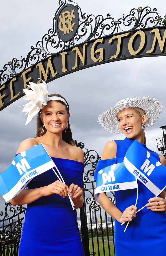 Laura Henshaw and Julia Viering in their Winx-inspired blue racewear for Flemington. Picture: Mark Stewart