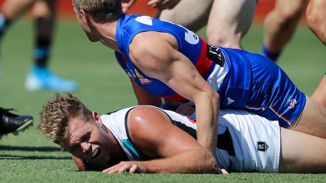 Dan Houston on the receiving end of a sling tackle against the Western Bulldogs. Picture: Matt Turner/AFL Photos via Getty Images