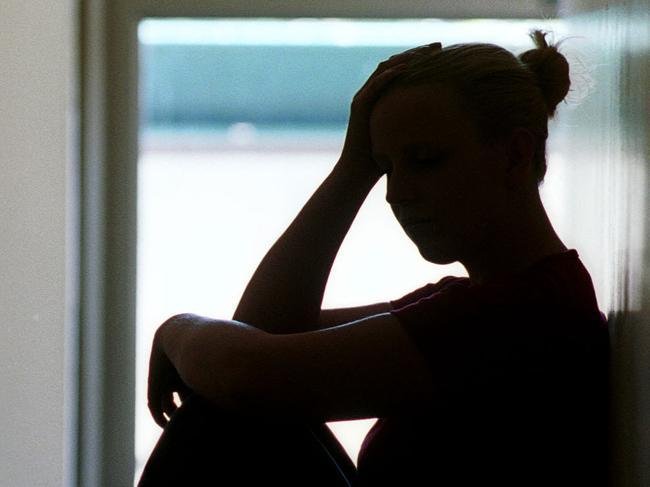 21 Dec 2001 Silhouette of young woman seated in doorway, date rape victim in Adelaide. Sexual Assault crime sa sex generic