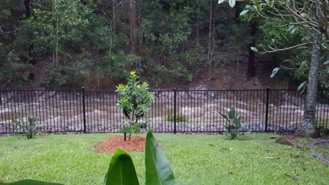 Bonogin woman Anne Greenwood said "the 'drain' at the back of our place is now a river". Picture: Anne Greenwood