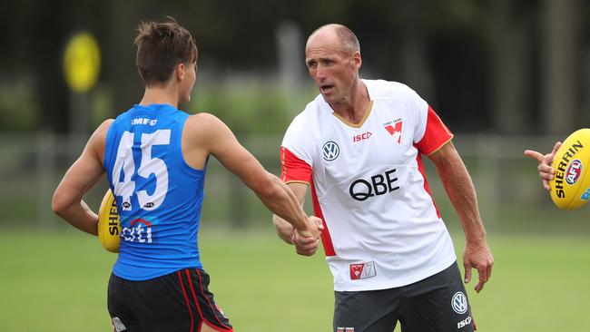 Sam Fisher meets Sydney legend Tony Lockett during his time at the Swans. Picture. Phil Hillyard