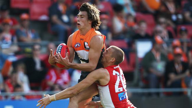 Greater Western Sydney's Caleb Marchbank takes strong mark ahead of Sydney Swans' Sam Reid during AFL match GWS Giants v Sydney Swans at Spotless Stadium. Picture. Phil Hillyard