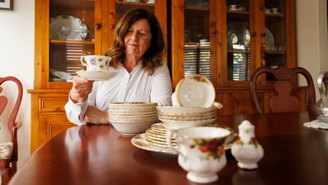 Vivienne Kroehn with China tea set salvaged from the ashes of her home during the Ash Wednesday bushfires in 1983. Picture: Matt Turner