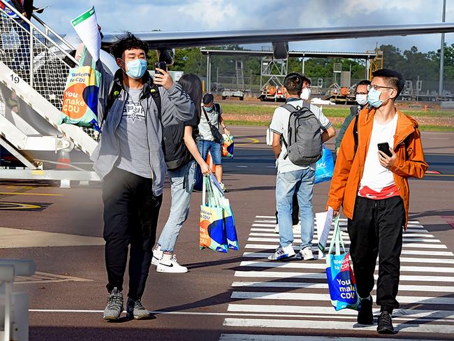 Foreign students disembark from an international flight at Darwin Airport last year. Picture: AFP