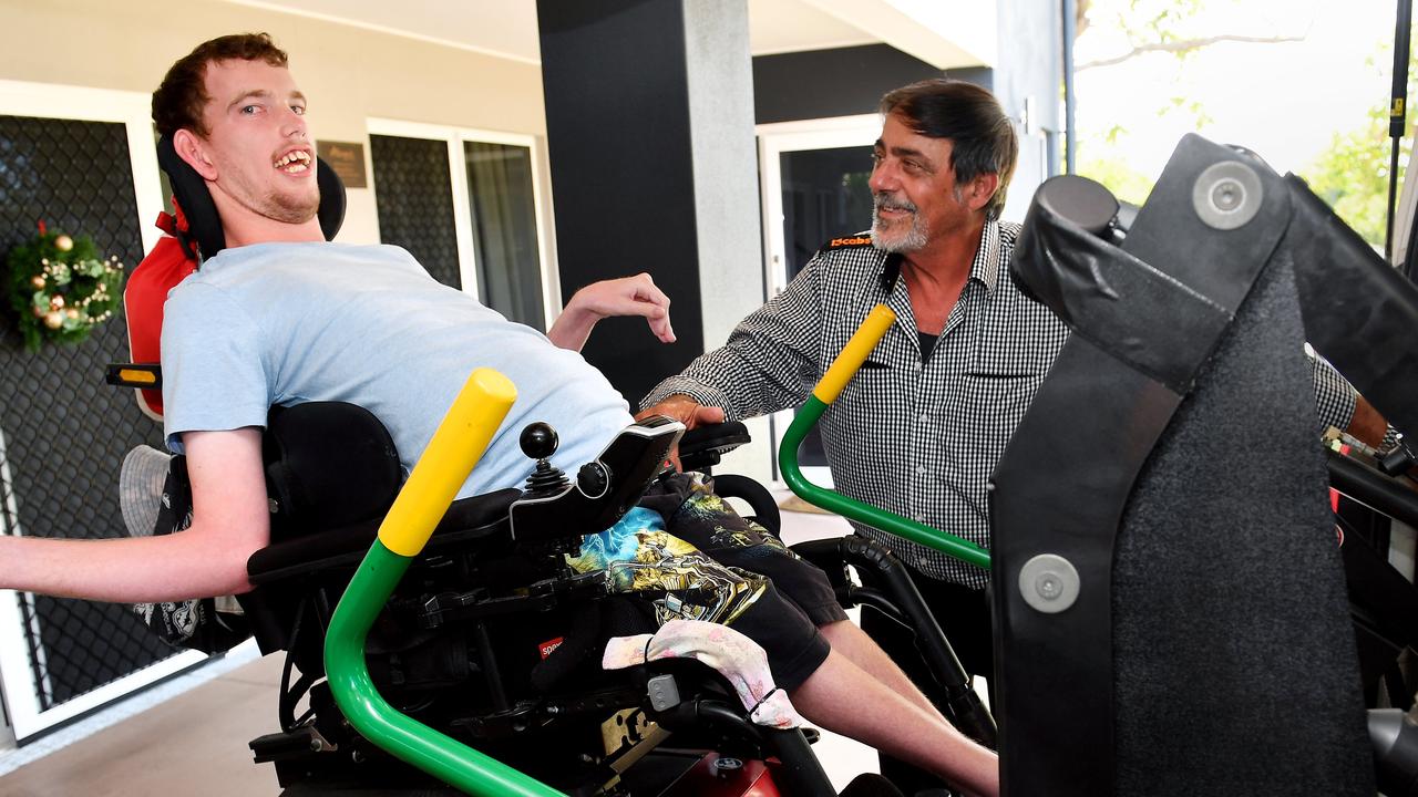 Taxi driver David Chetcuti helps Anthony Austin into his taxi. Picture: Tony Martin