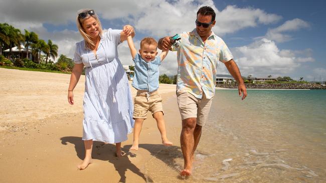 Renee Branton-Brown and husband Justin Buhagiar with three-year-old son Brodie on Airlie Beach. Picture: Andrew Pattinson