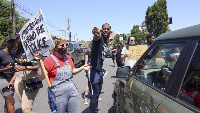 Protestors block University Avenue outside the Wendy's fast food restaurant. Picture: AP