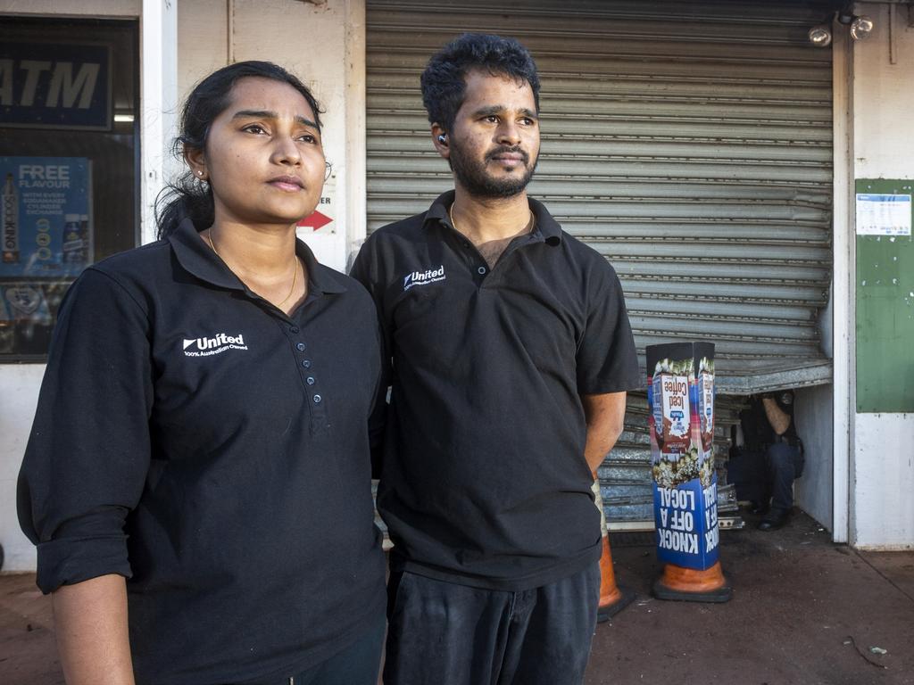 Forensic police collect evidence at the United Petroleum Noonamah as owners Apoorva Chilukuri and Ram Kolan wait for the roller door technician to arrive. Picture: Floss Adams.