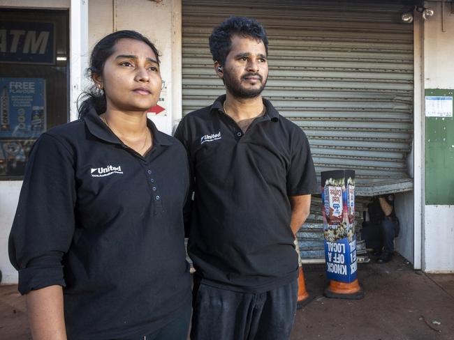 Forensic police collect evidence at the United Petroleum Noonamah as owners Apoorva Chilukuri and Ram Kolan wait for the roller door technician to arrive. Picture: Floss Adams.