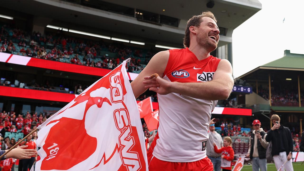 SYDNEY, AUSTRALIA - JUNE 29: Harry Cunningham of the Swans and team mates run onto the field during the round 16 AFL match between Sydney Swans and Fremantle Dockers at SCG, on June 29, 2024, in Sydney, Australia. (Photo by Cameron Spencer/Getty Images)