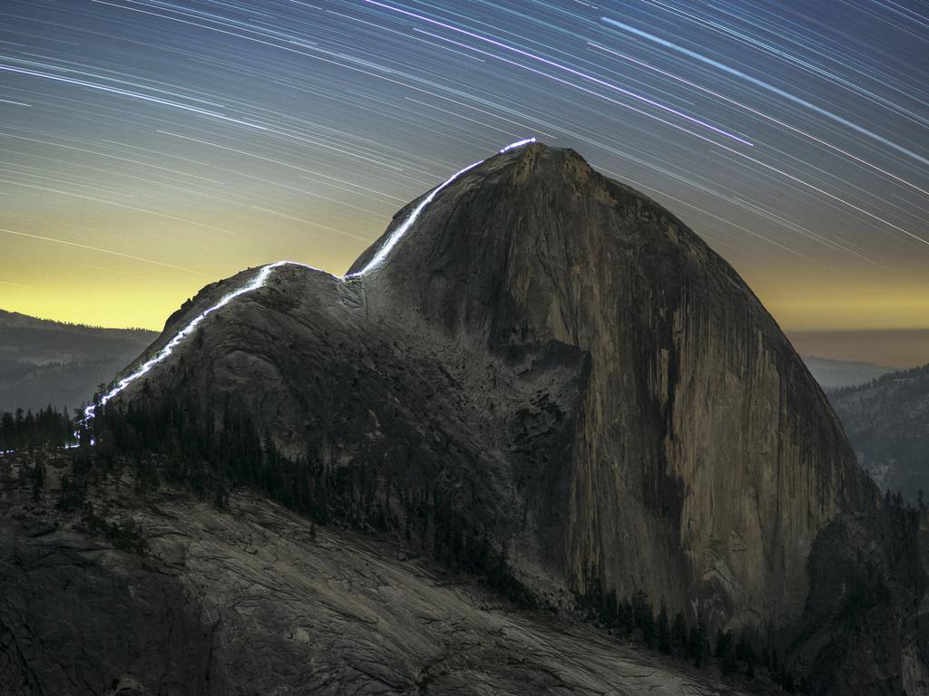 Insight Astronomy Photographer of the Year 2017- People and Space: Kurt Lawson (USA) with The Cable Route of Half Dome at Night (Runner Up) Sean Goebel and I embarked on a mission to shoot a night hike up the Cable Route of Yosemiteâ€™s incredible Half Dome. For us it entailed hiking some 110 lbs of gear and water between the two of us to the summit of Mount Watkins, a sculpted rocky mountain that forms a prominent point northeast of Half Dome on the other side of Tenaya Canyon. From Mount Watkins, we set up our 5 cameras for time lapse and stills while our friend Wade Meade made the ascent from Yosemite Valley to the summit lighting the trail with a small lantern and some bright headlamps. Luck prevailed and we had nearly clear skies to capture the movement of the stars above this incredible landscape. Wade had no trouble reaching the summit at night.