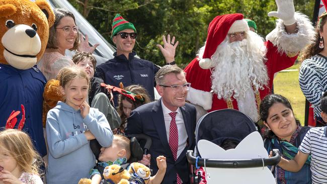 Premier Dominic Perrottet with children and Santa at Bear Cottage children's hospice in Manly on Friday. Picture: Simon Bullard