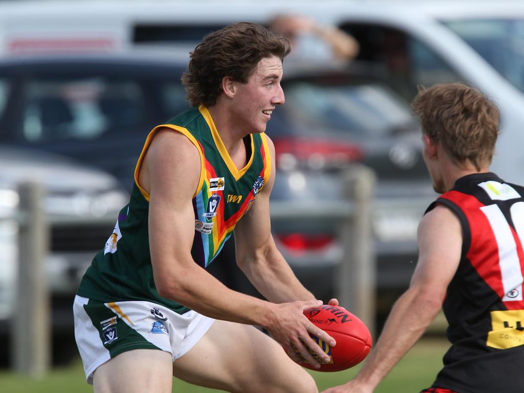 Leopold’s Harris Jennings and Newtown &amp; Chilwell’s Michael Condy. Picture: Mark Wilson