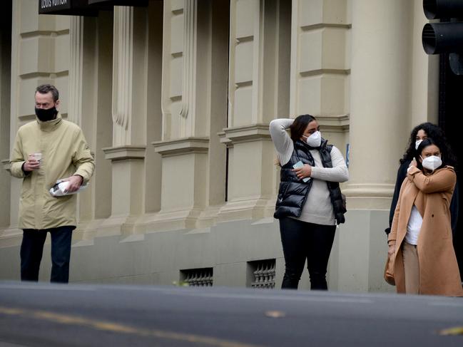 Melburnians wearing masks in the city. Picture: Andrew Henshaw