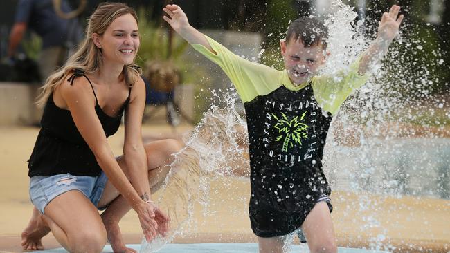 Abby Taylor and son Ashton 6, cool down yesterday at the local swimming pool in Bundamba, near Ipswich, west of Brisbane. Picture: Lyndon Mechielsen