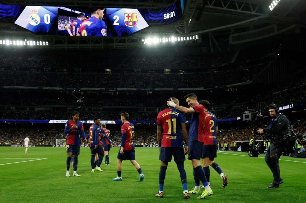 At the double: Barcelona's Polish forward Robert Lewandowski (C) celebrates scoring his team's second goal