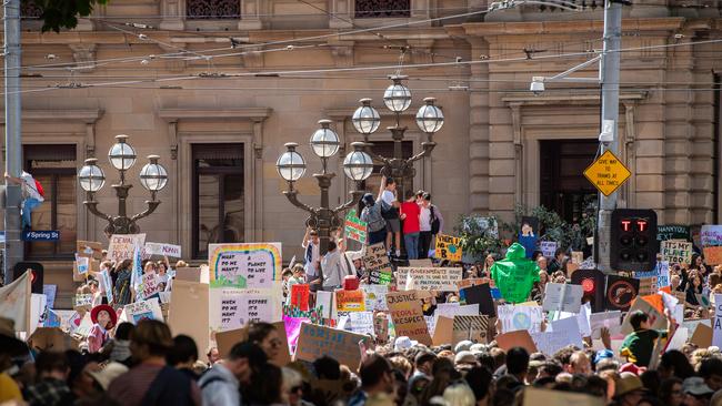 Students protesting outside the Old Treasury Building today. Picture: Jason Edwards