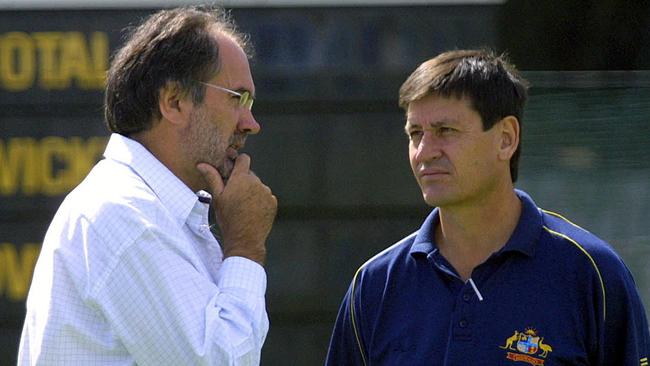 Zimbabwe cricket team manager Vince Hogg talks with Australian team manager Steve Bernard in 2004.