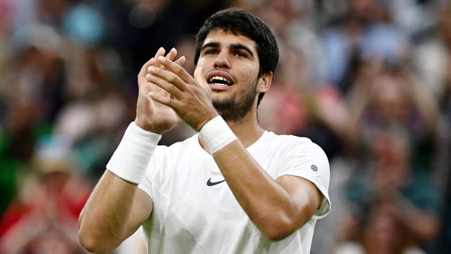 LONDON, ENGLAND - JULY 10: Carlos Alcaraz of Spain acknowledges the crowd following victory against Matteo Berrettini of Italy in the Men's Singles fourth round match during day eight of The Championships Wimbledon 2023 at All England Lawn Tennis and Croquet Club on July 10, 2023 in London, England. (Photo by Mike Hewitt/Getty Images)