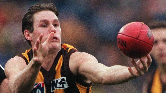 May 31, 1997. Hawthorn v Collingwood. Hawk Justin Crawford juggles the ball in front of Paul Williams. Picture: Joe Sabljak.a/ct/afl