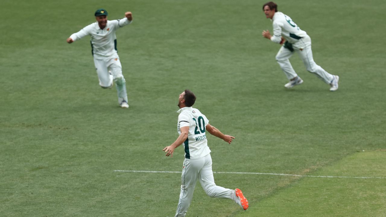 Webster celebrates with his Tasmanian teammates after dismissing Jackson Bird to secure the Tigers’ first Sheffield Shield win this season. Picture: Jason McCawley / Getty Images