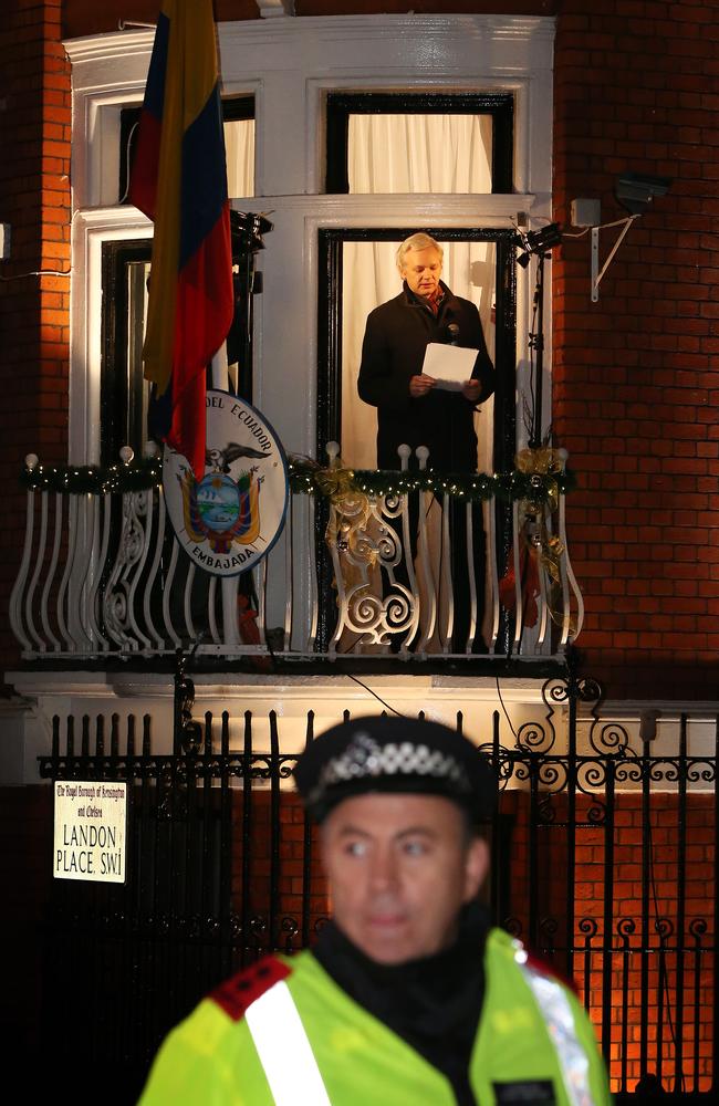 A policeman watches the crowd as WikiLeaks founder Julian Assange speaks from the Ecuadorean Embassy in London in 2012. Picture: Peter Macdiarmid/Getty Images