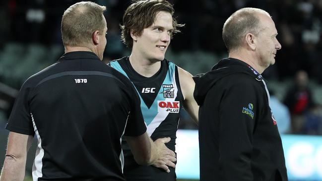 Port Adelaide’s Jared Polec with assistant coach Michael Voss and head coach Ken Hinkley after the loss to Essendon. Picture SARAH REED