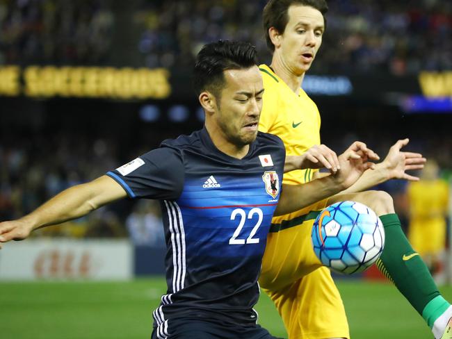 World Cup Qualifier,  Australia V's Japan at Etihad Stadium, Docklands, Melbourne Australia, 11th October  2016.   Maya Yoshida of Japan  battles with Australia's Robbie KrusePicture : George Salpigtidis